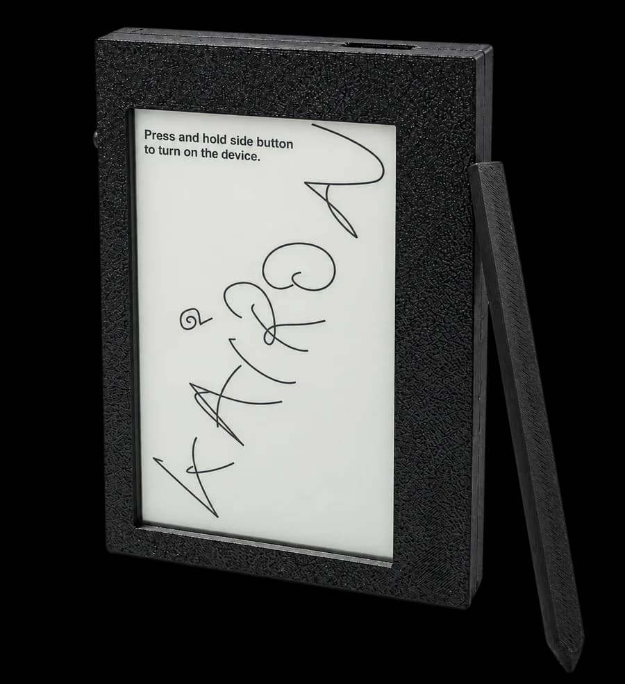 The Kairon prototype: a small black writing tablet with a 4.7 inch electronic paper screen and a stylus
