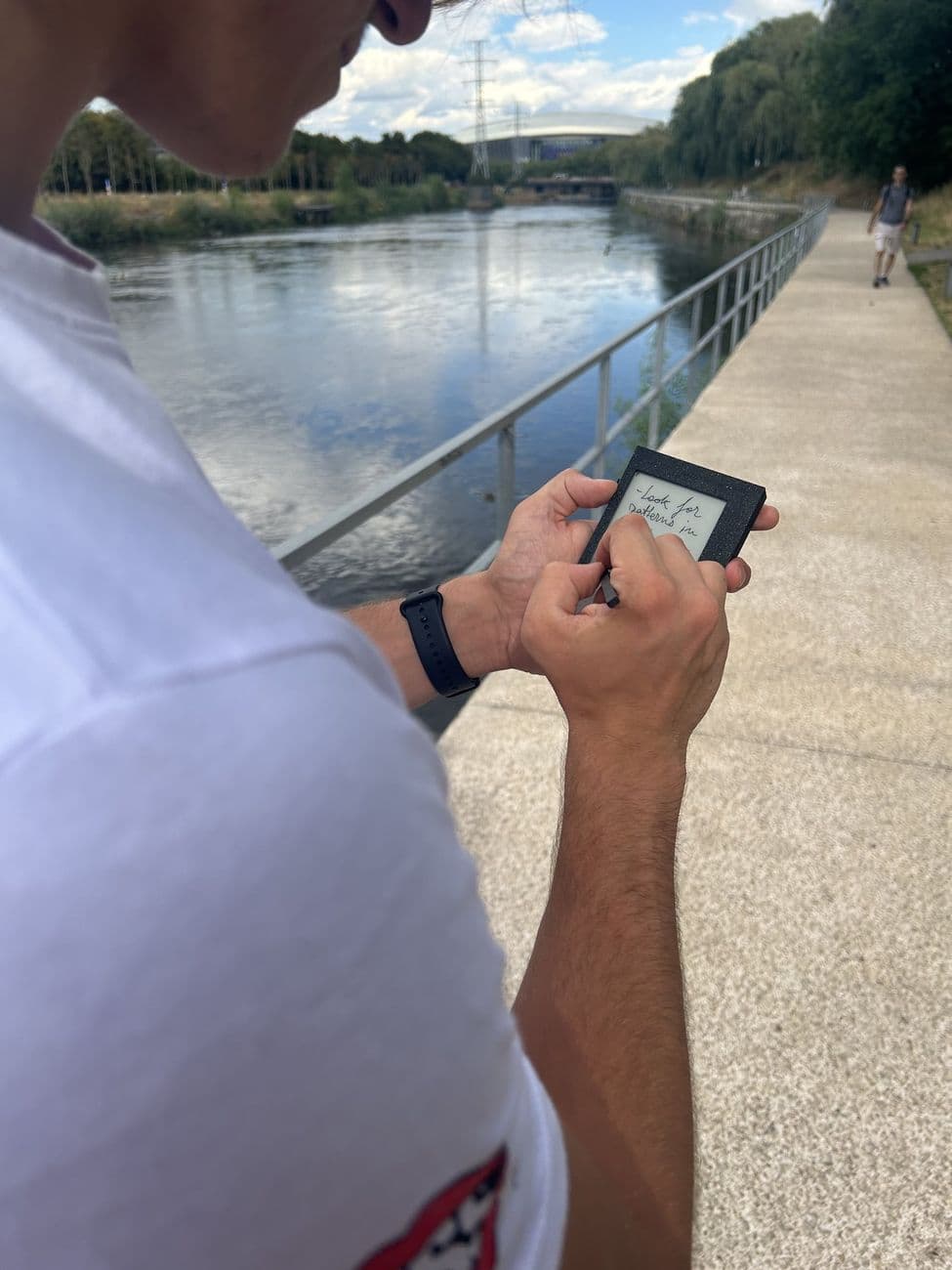 Writing a thought on Kairon while walking beside a river